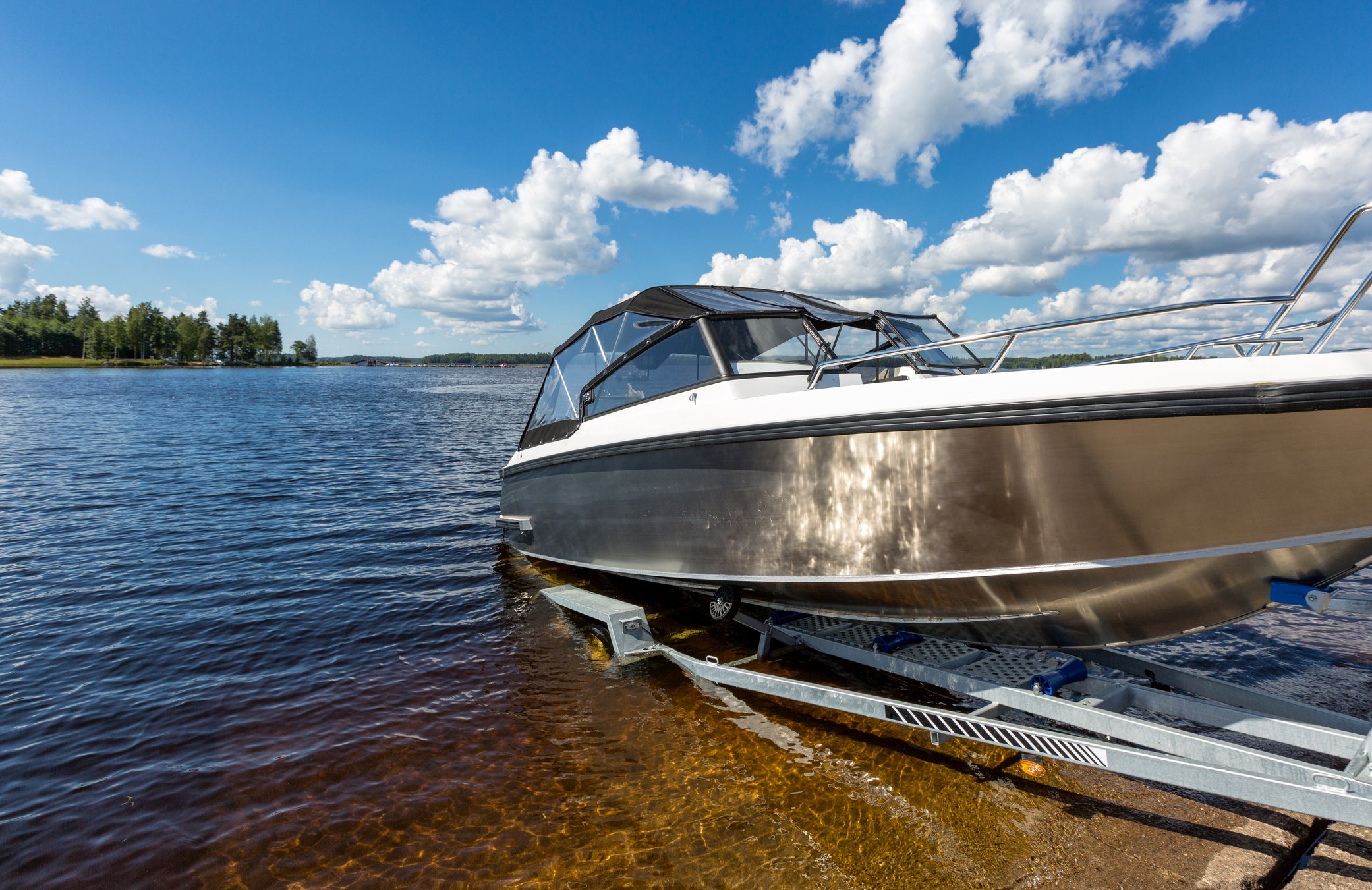 Boat launch on lake water from trailer